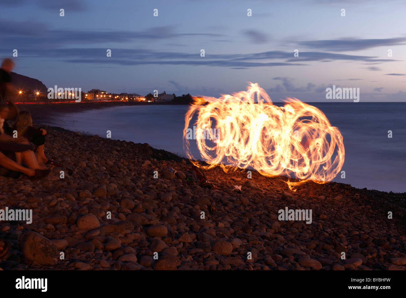 Fire dancer with torches, La Playa, Valle Gran Rey, La Gomera, Canary Islands, Spain, Europe Stock Photo