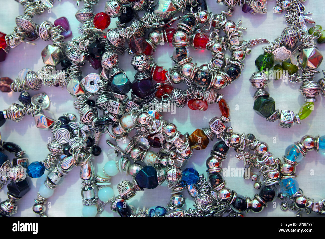 silver jewel bracelet shop display colorful stones Stock Photo