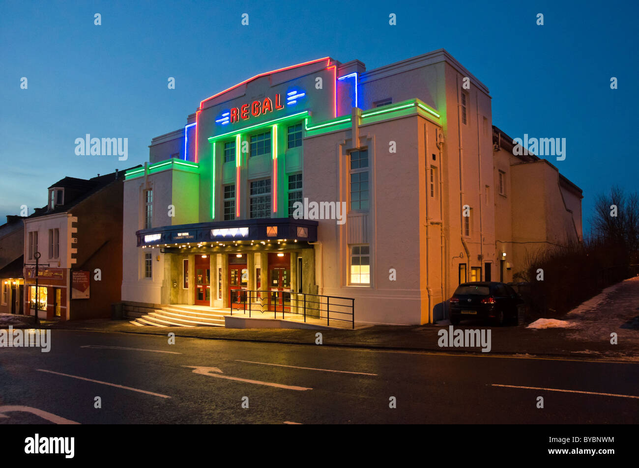 Formerly a cinema the illuminated The Regal in Bathgate West Lothian Scotland is now a community theatre Stock Photo