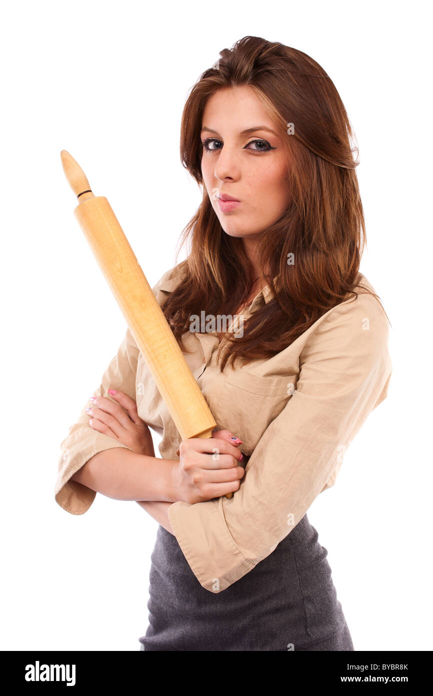 Angry businesswoman with roller pin, ready to punish Stock Photo