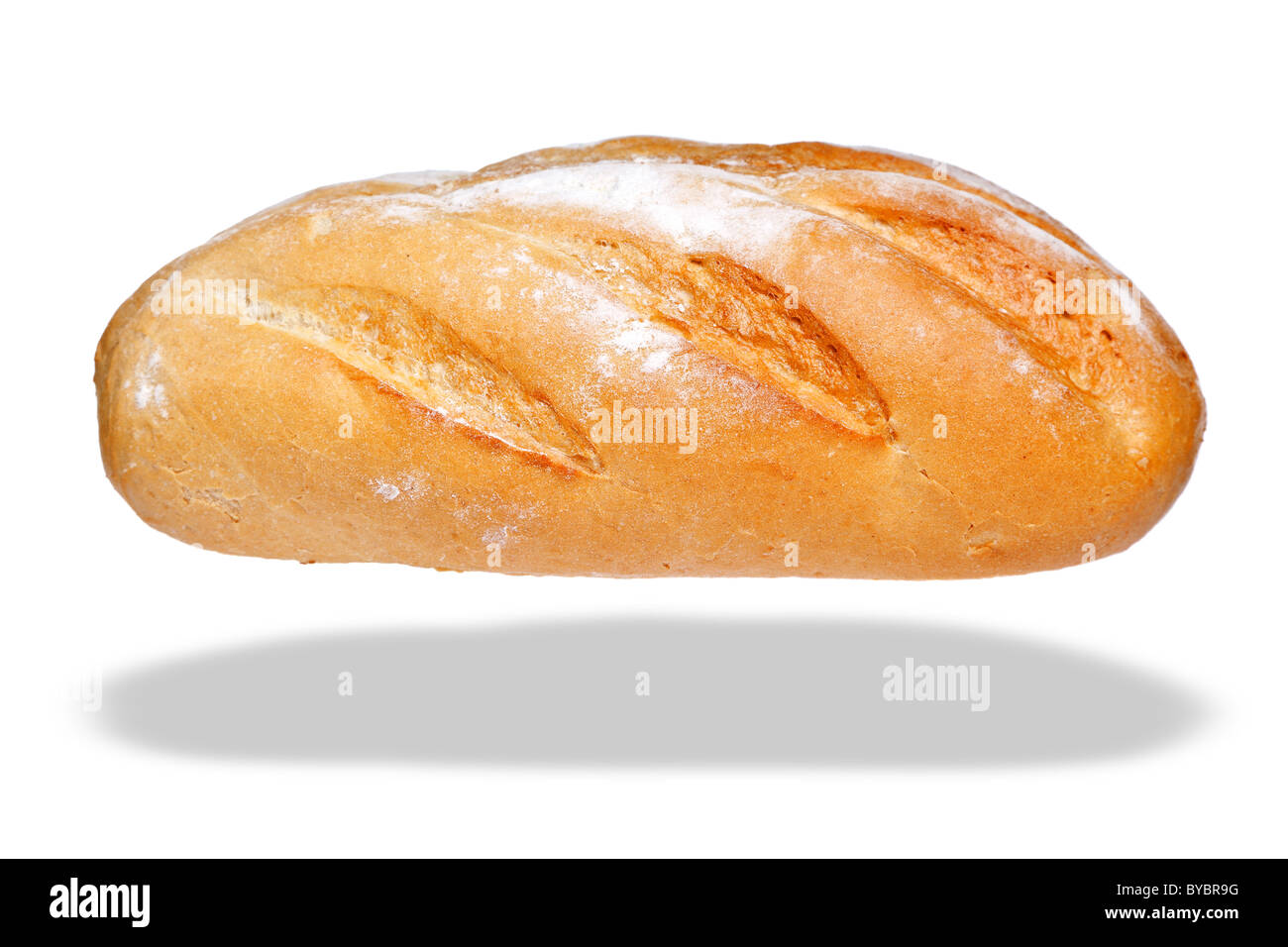 Photo of a white bloomer loaf of bread, isolated on a white background with floating shadow. Stock Photo