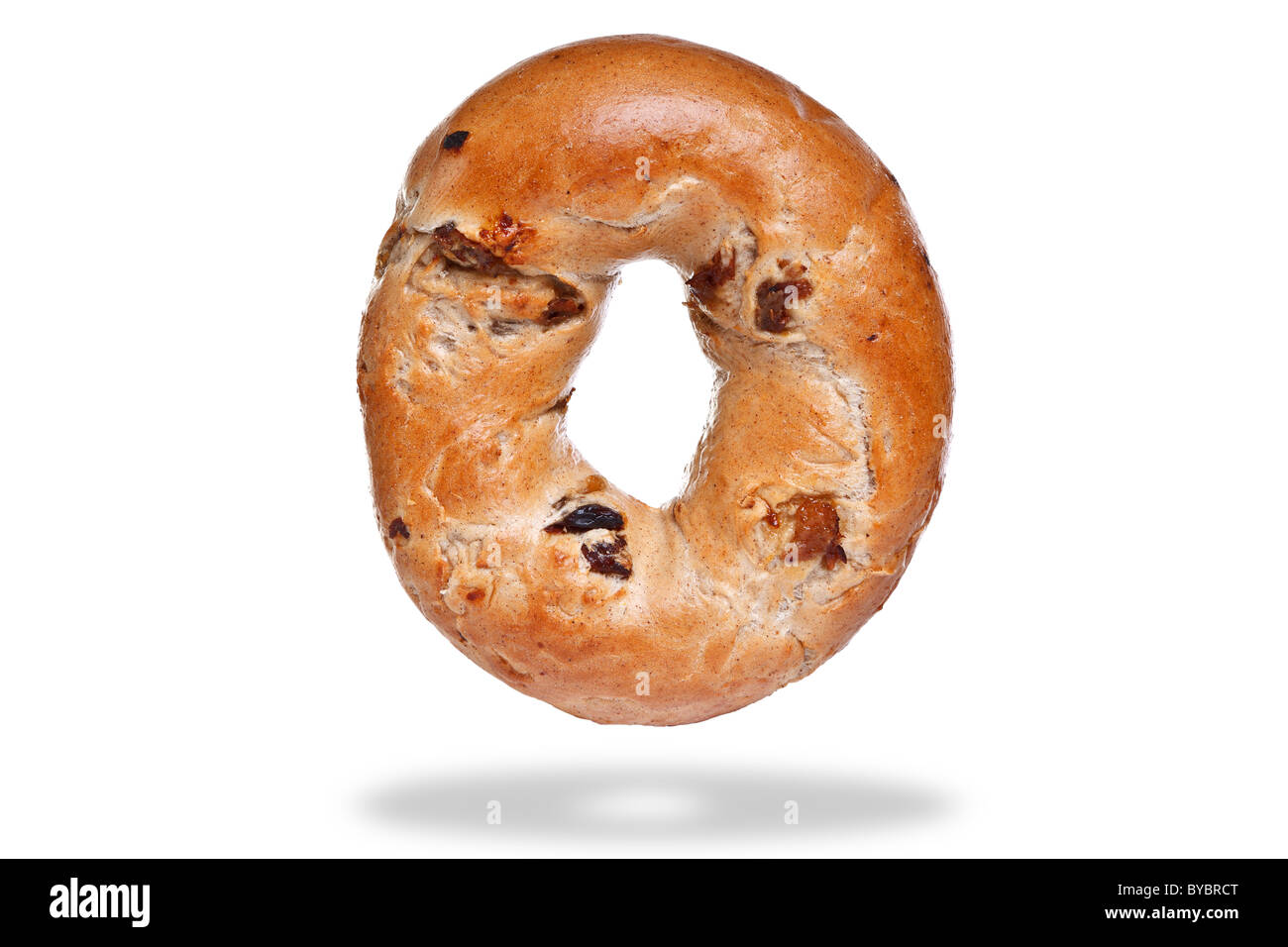 Photo of a cinnamon and raisin bagel, isolated on a white background with floating shadow. Stock Photo