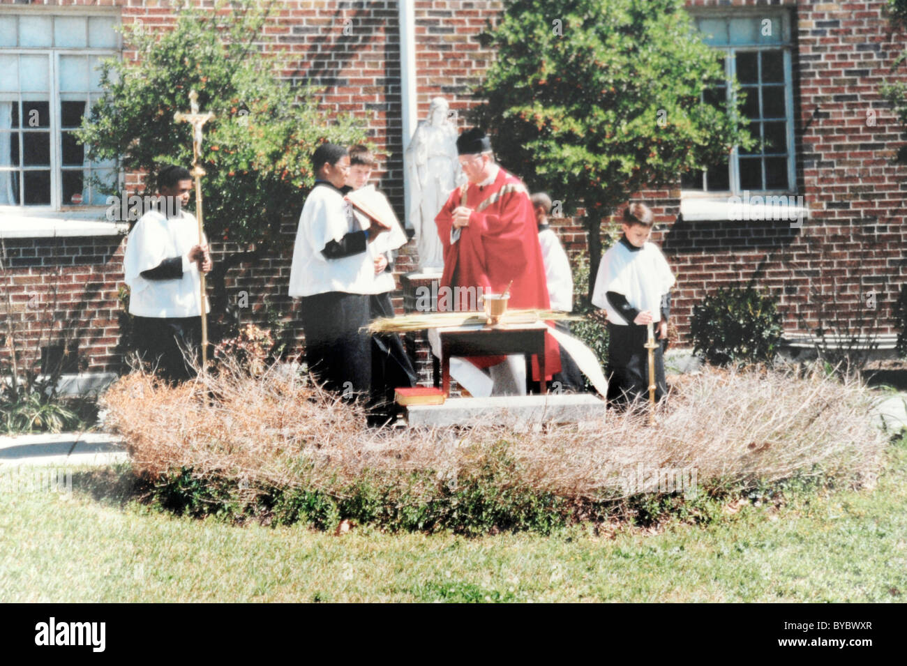 Palm Sunday Catholic ceremony with priest blessing the palms Stock