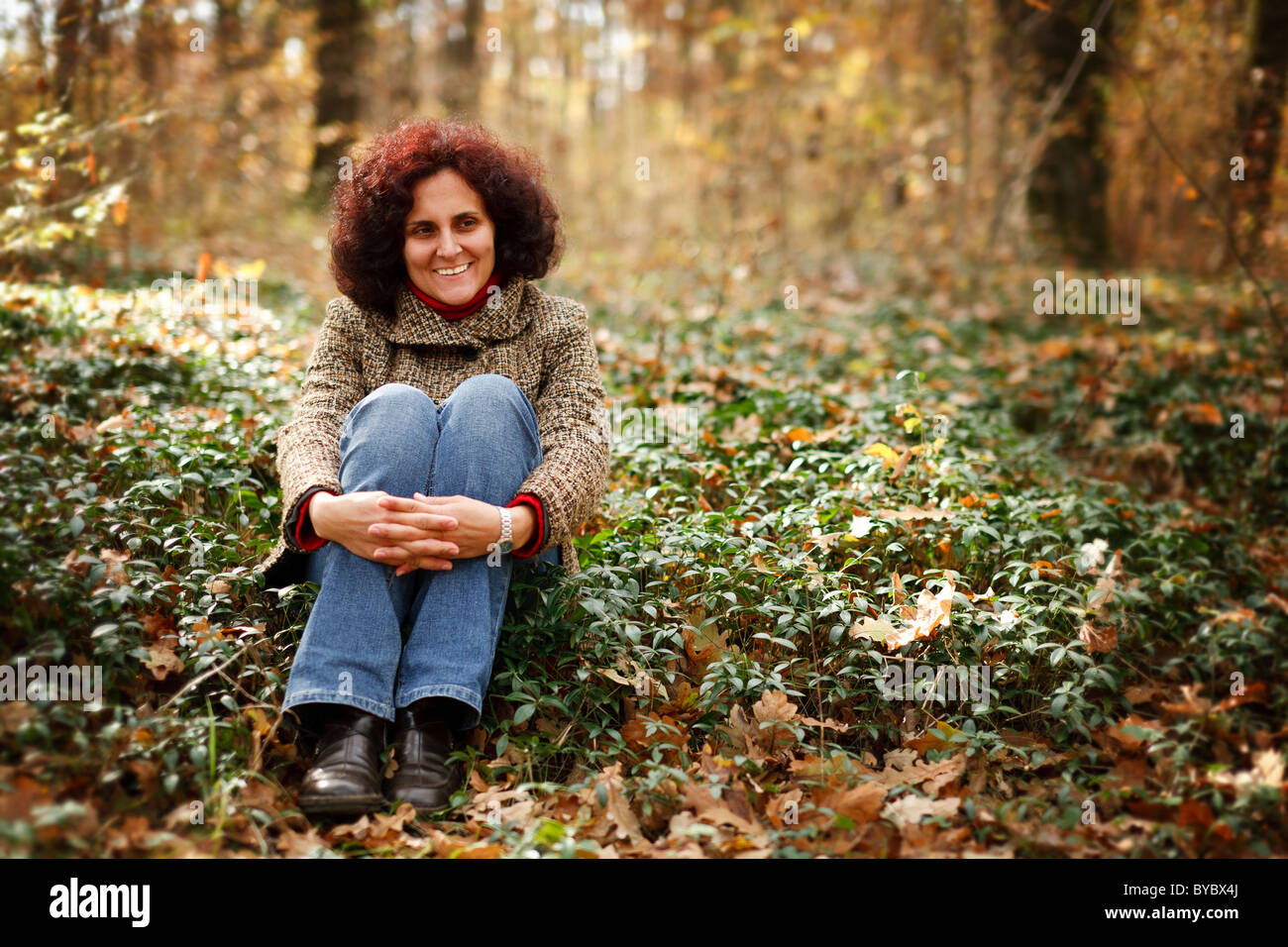 Portrait of a happy young woman outdoor in the forest Stock Photo - Alamy