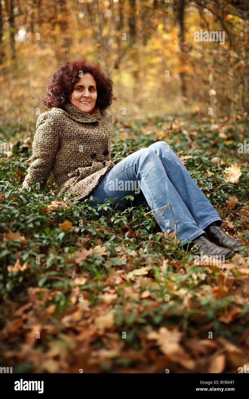 Portrait of a happy young woman outdoor in the forest Stock Photo - Alamy