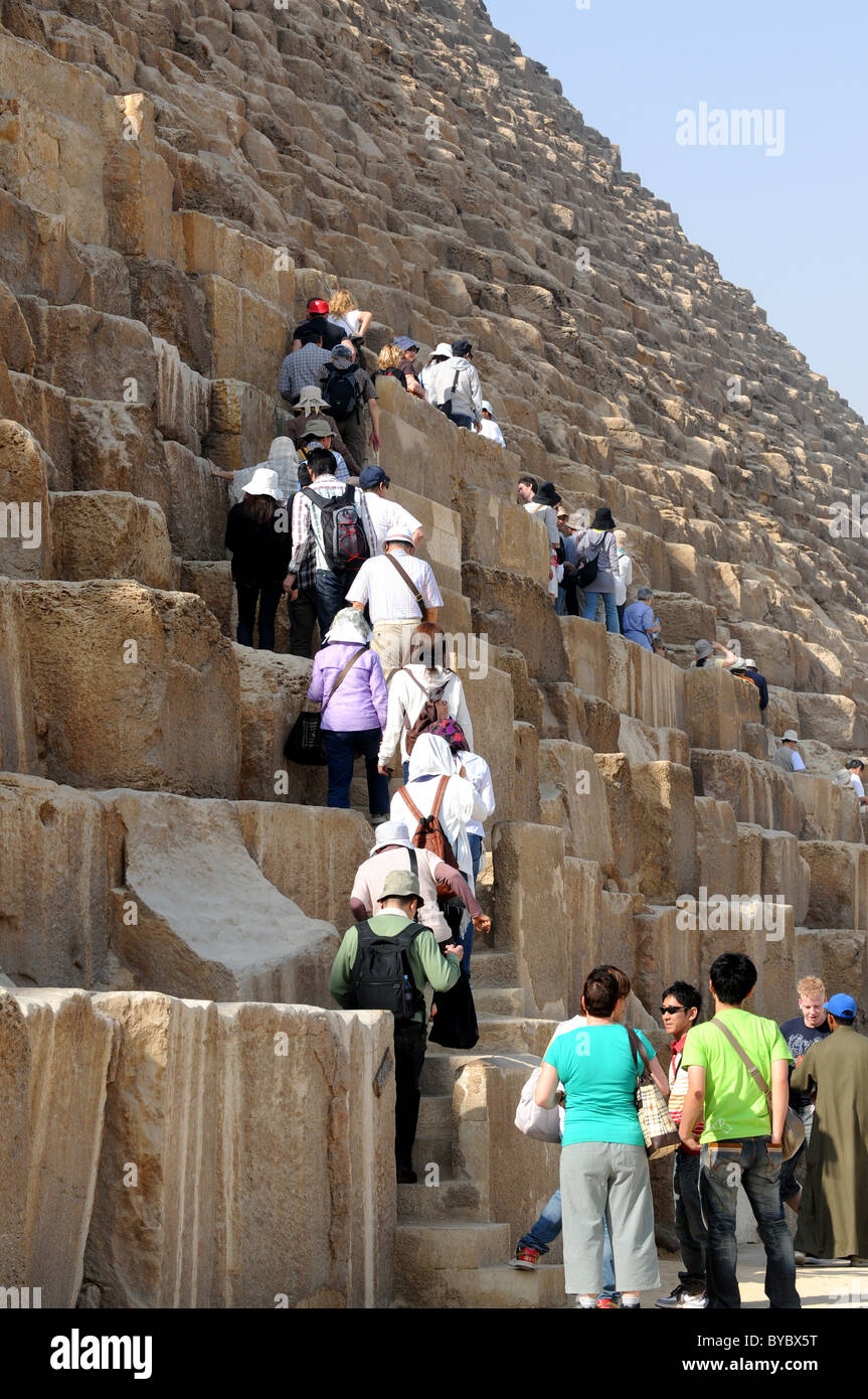 Pyramid, Giza, Egypt, tourists climb on the only open Pyramid, Giza