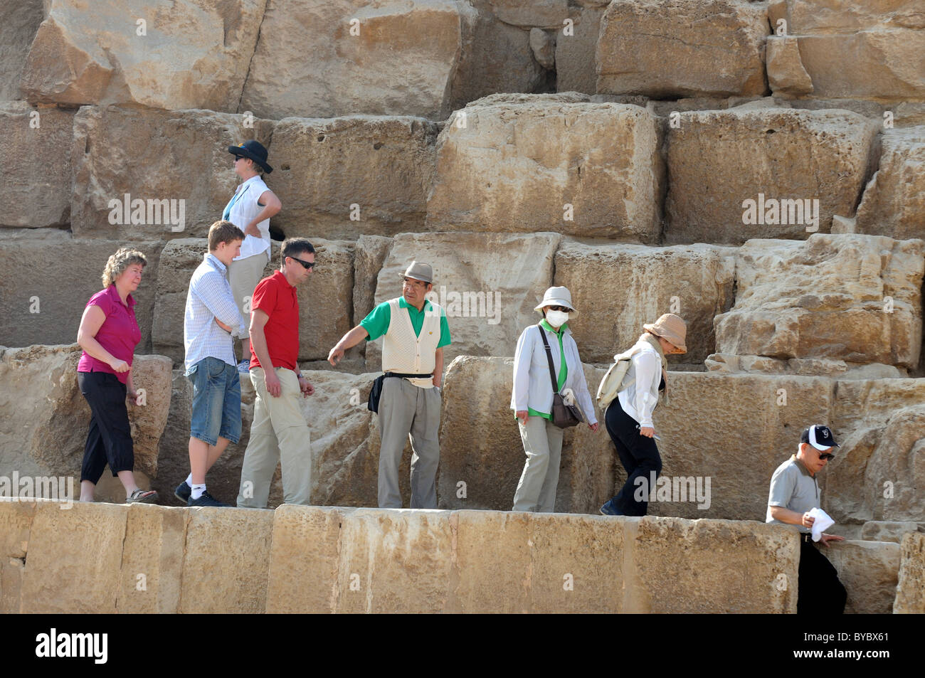 Pyramid, Giza, Egypt, tourists climb on the only open Pyramid, Giza