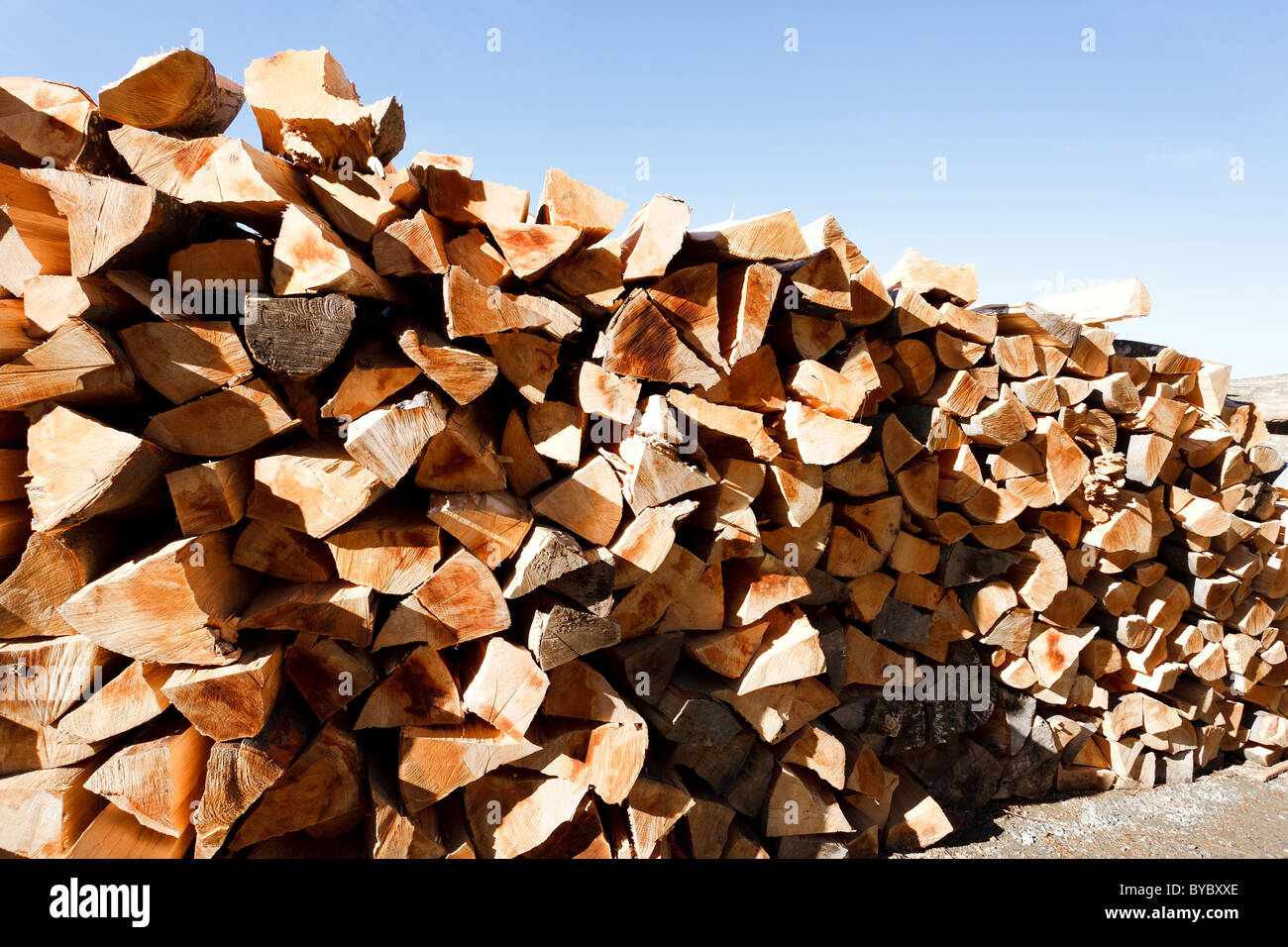 Stack of beech firewood under clear blue sky Stock Photo Alamy