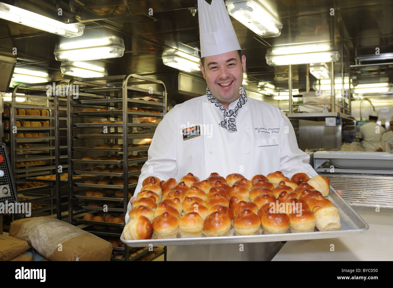 Nicholas Oldroyd, executive chef for Cunard's ship, Queen Elizabeth, in the kitchen where bread and rolls are baked. Stock Photo