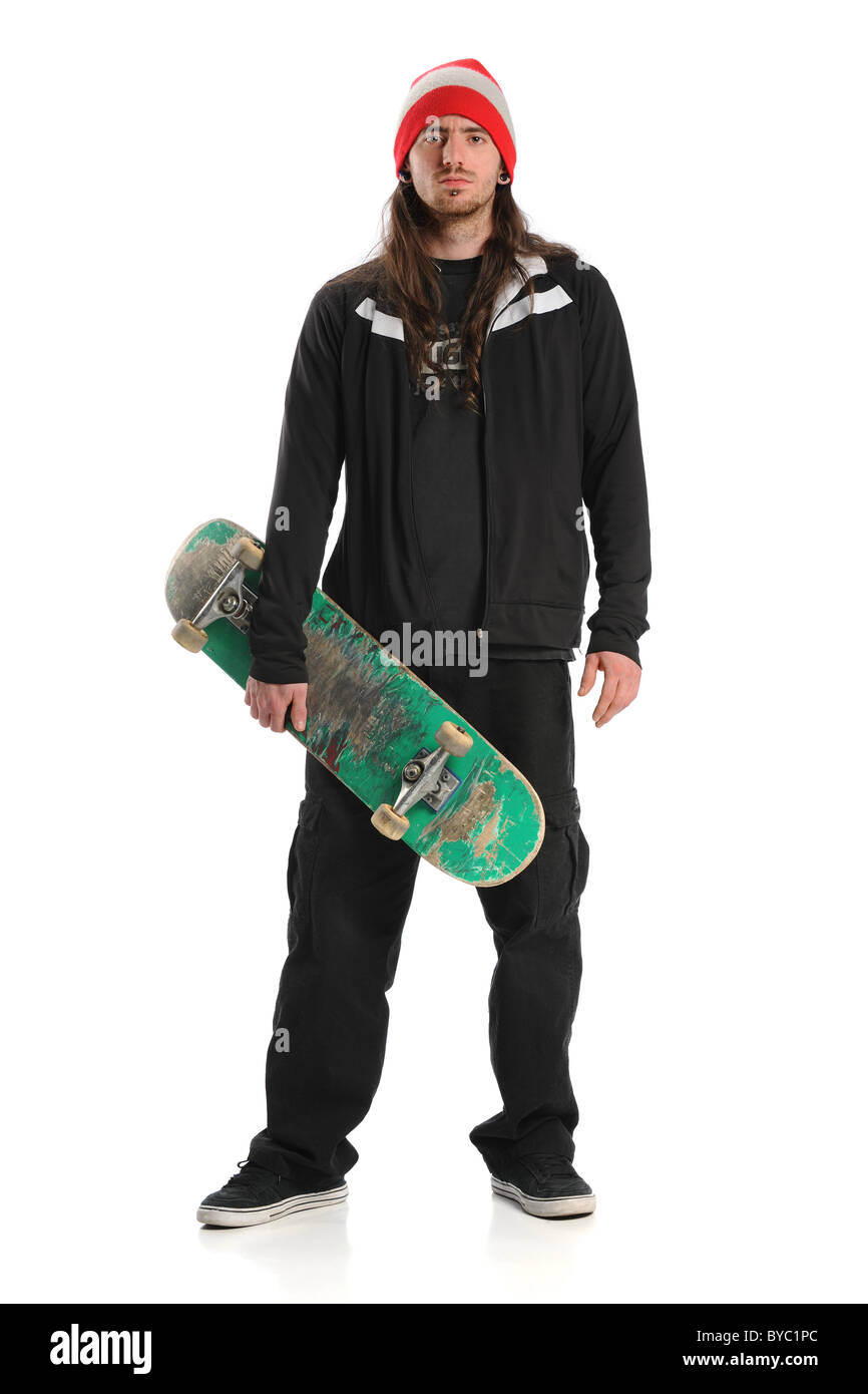 Portrait of skateboarder standing isolated over white background Stock Photo