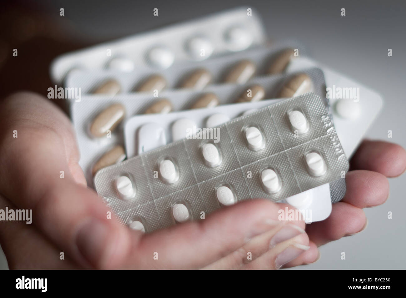 hands holding prescription drugs Stock Photo
