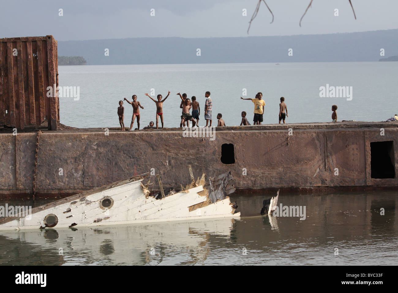 Children playing on Rabaul wreck Stock Photo