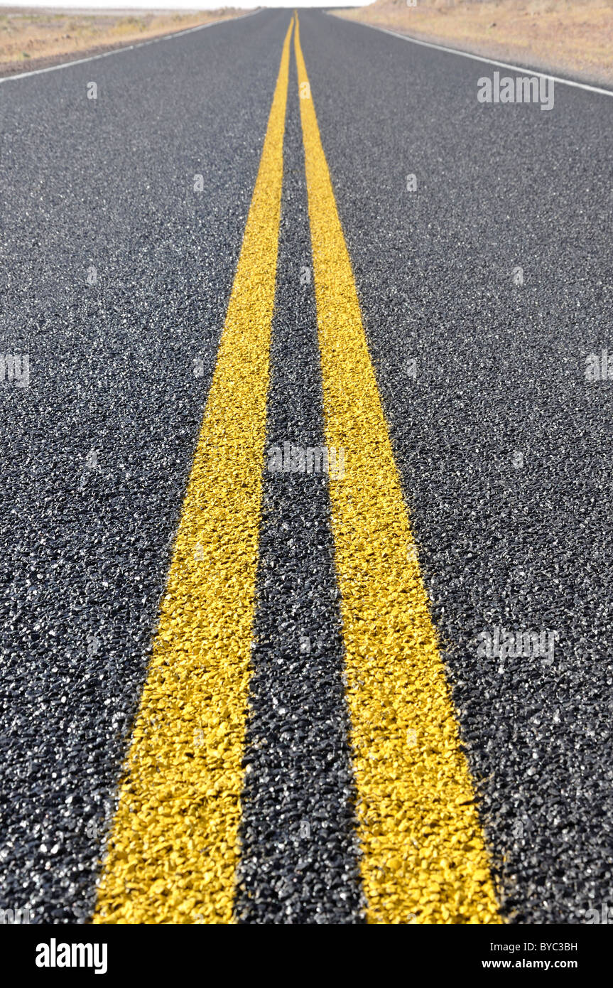Closeup of the yellow road dividing line Stock Photo