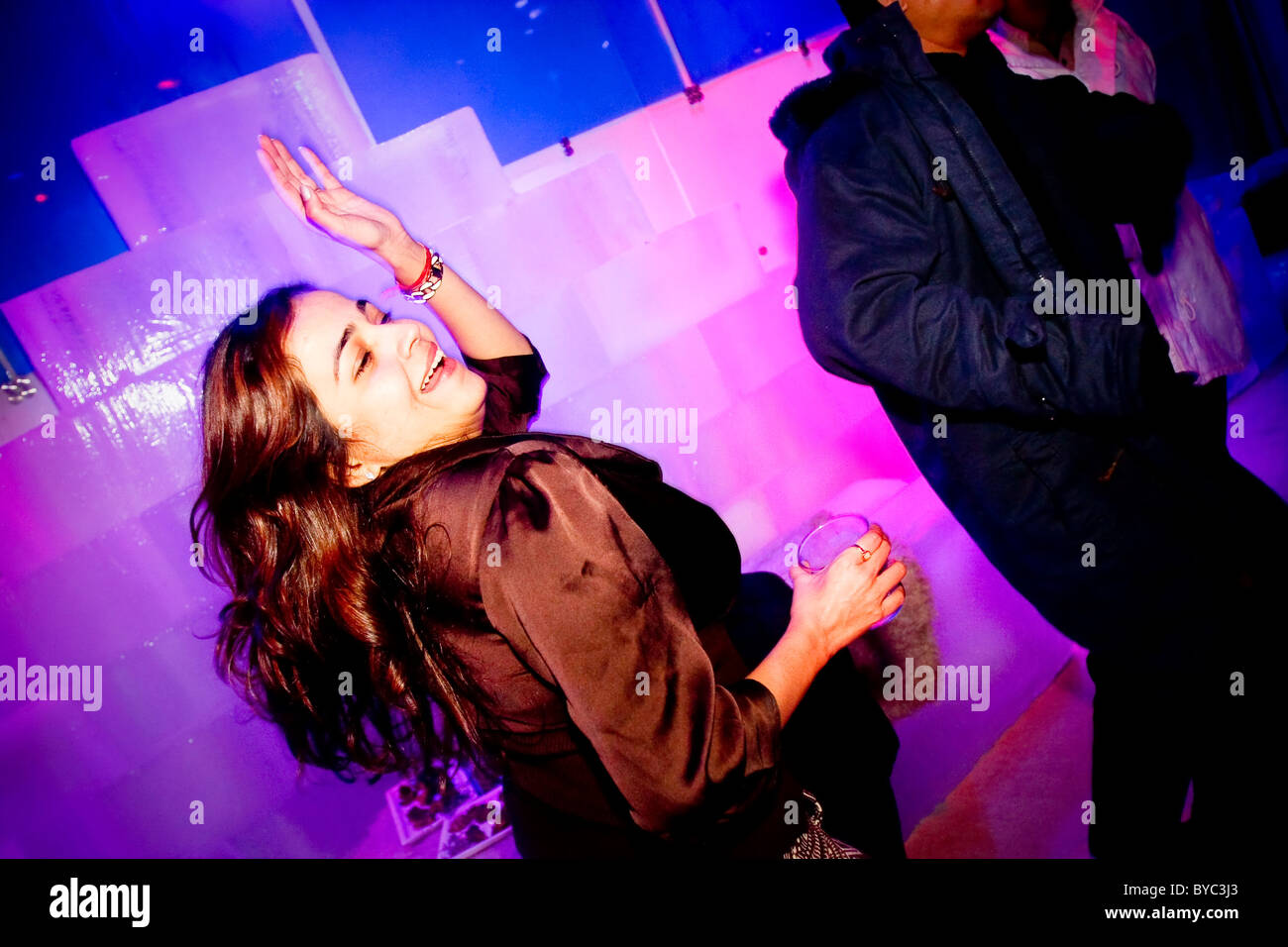 A guest dances at the nightclub 21 Fahrenheit, India's first ice bar, in Mumbai (Bombay) in India Stock Photo