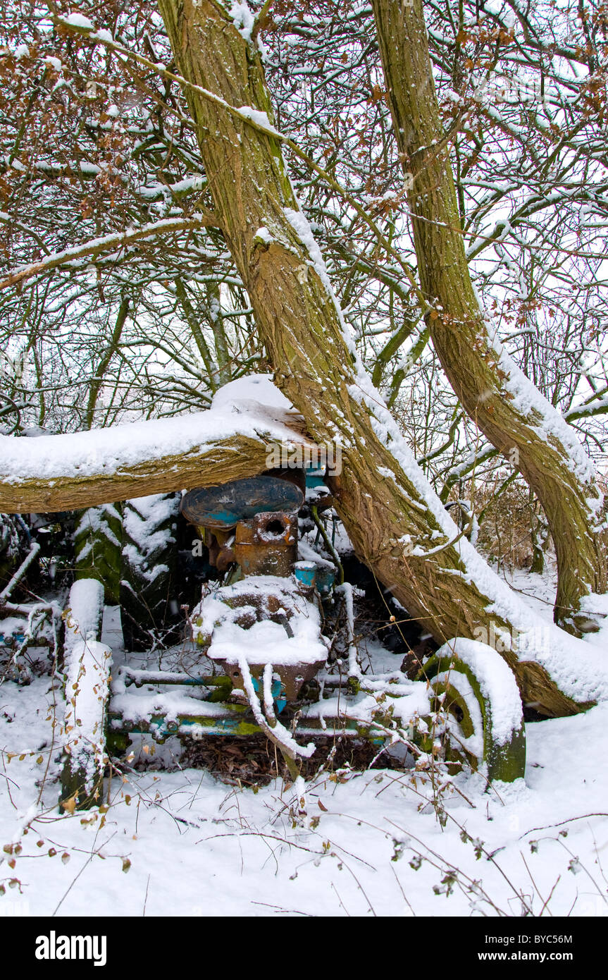 Abandoned tractors in the snow, Bunny, Nottingham, England Stock Photo
