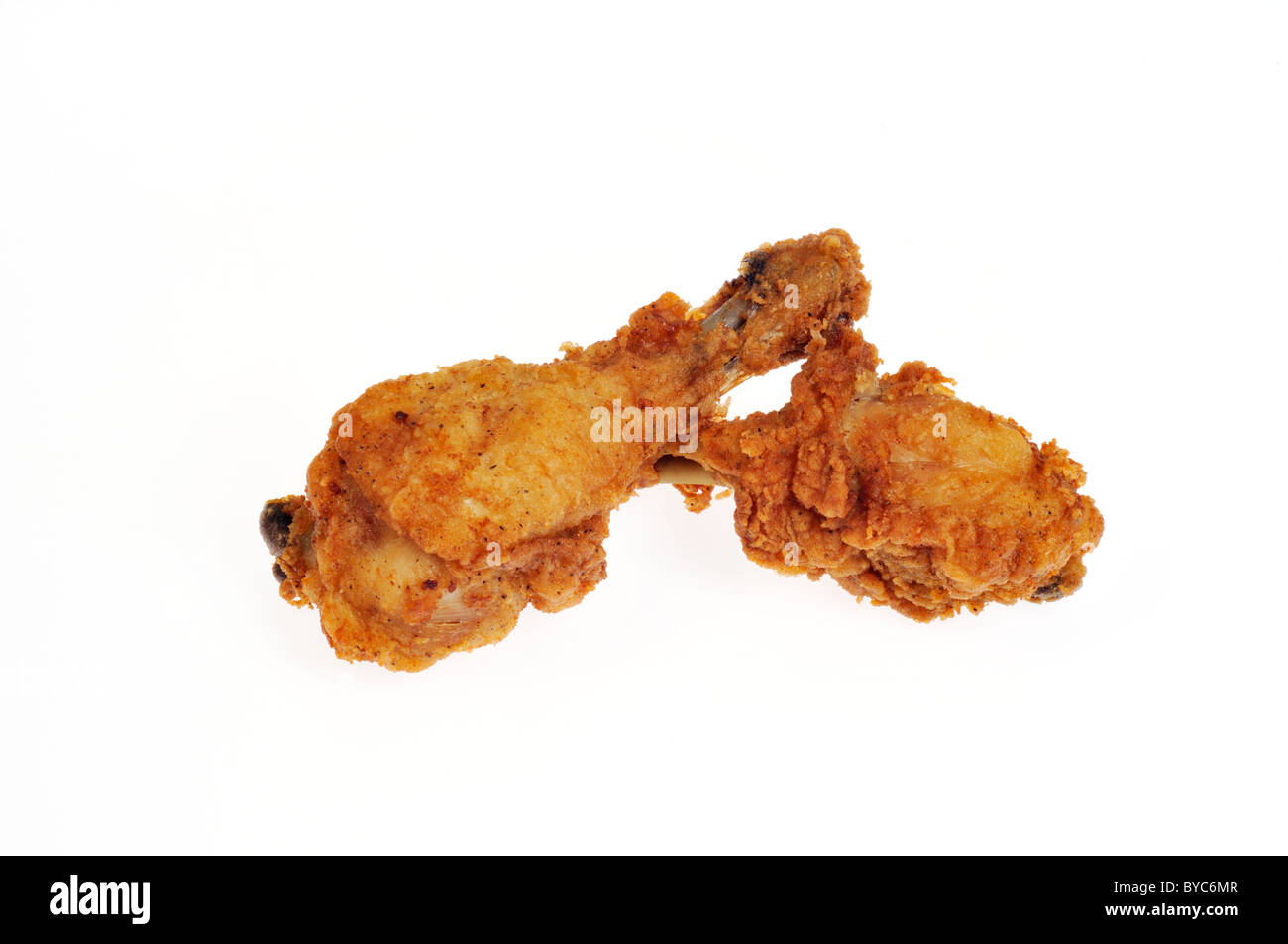 Fried chicken drumsticks on white background cutout Stock Photo