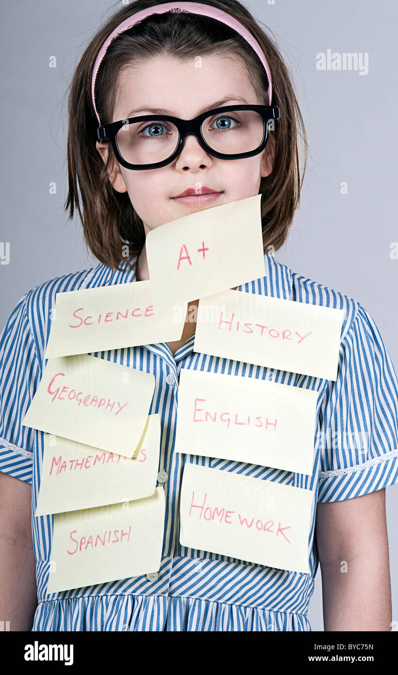 Nerdy School Girl Covered with Post-It notes Stock Photo