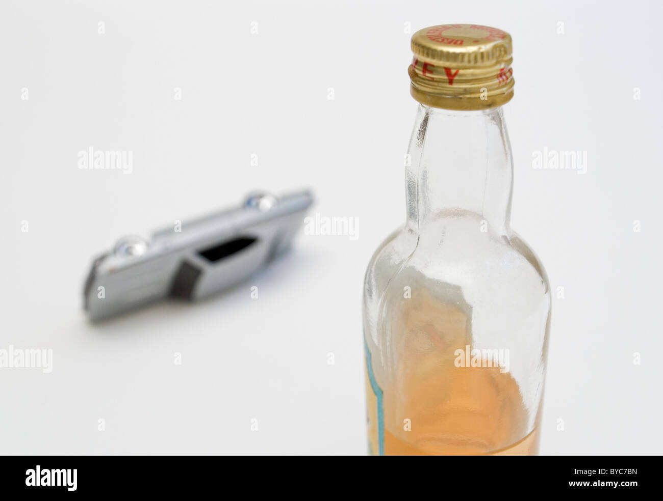 bottle of liquor and car accident Stock Photo - Alamy