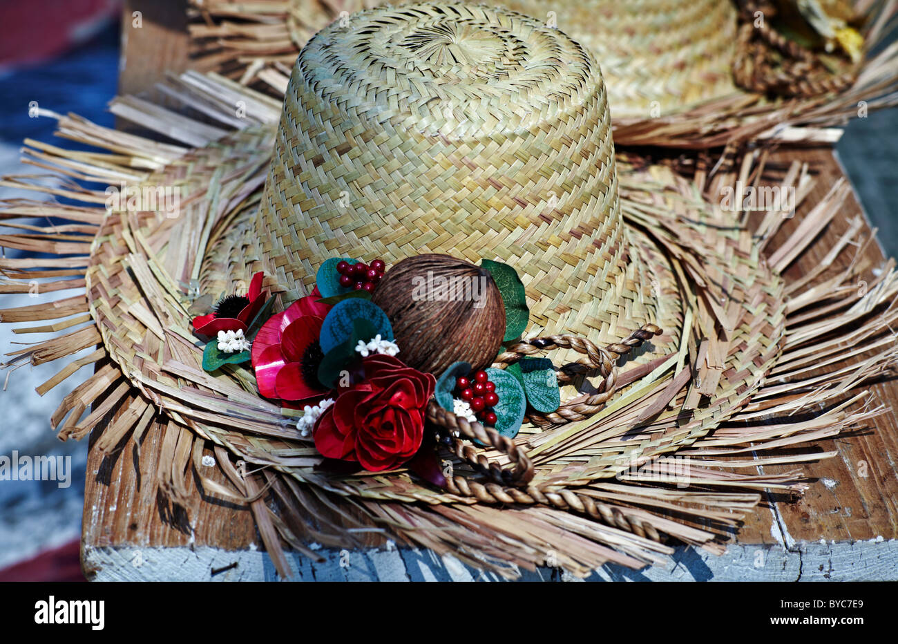 Tattered Straw hat and embellishments at a tropical location. Thailand S. E. Asia Stock Photo