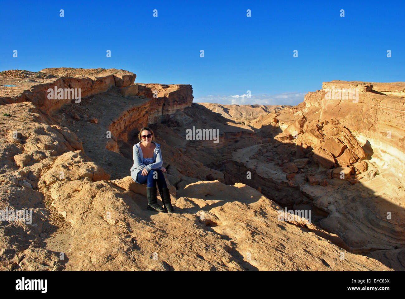 Tourist by Shubiel gorge near Tozeur, Tunisia Stock Photo