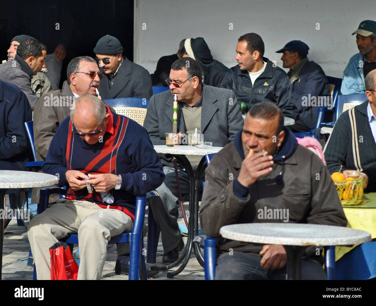 Tunisian cafe scene, people smoking cigarettes and shisha, Sousse, Tunisia Stock Photo