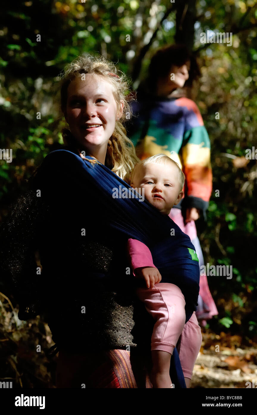 Mother, Daughter and Grandmother pausing on a woodland walk, Wales. Stock Photo