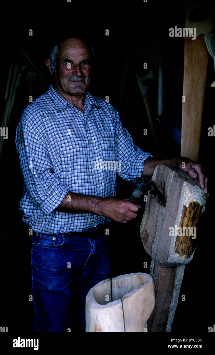 A woodcarver poses in his workshop in Madeira Stock Photo