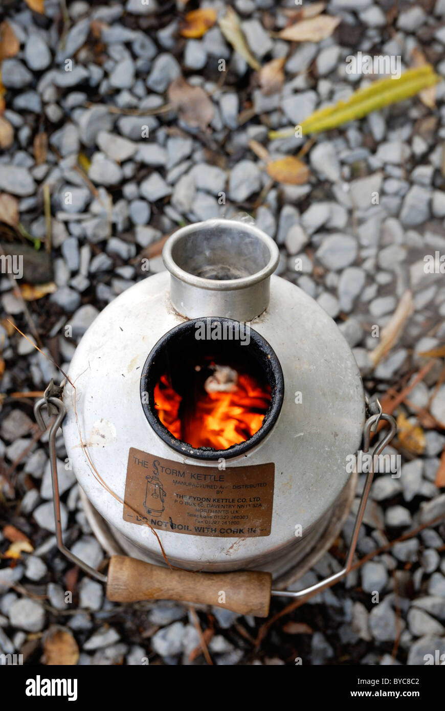 Storm or Kelly Kettle, boiling water from small wood fuel, Wales Stock Photo