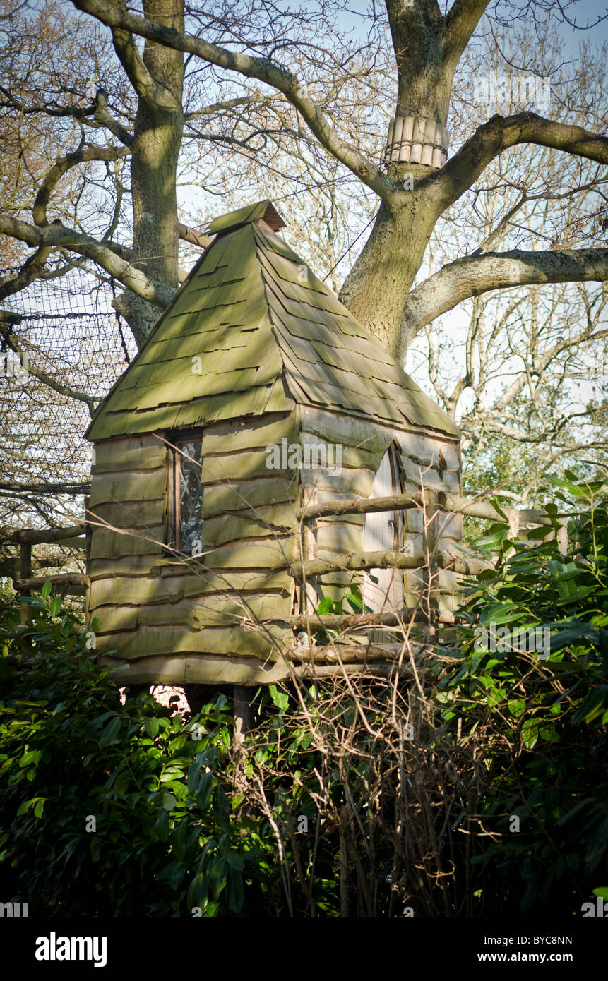 A wooden tree house with leaded windows Stock Photo - Alamy