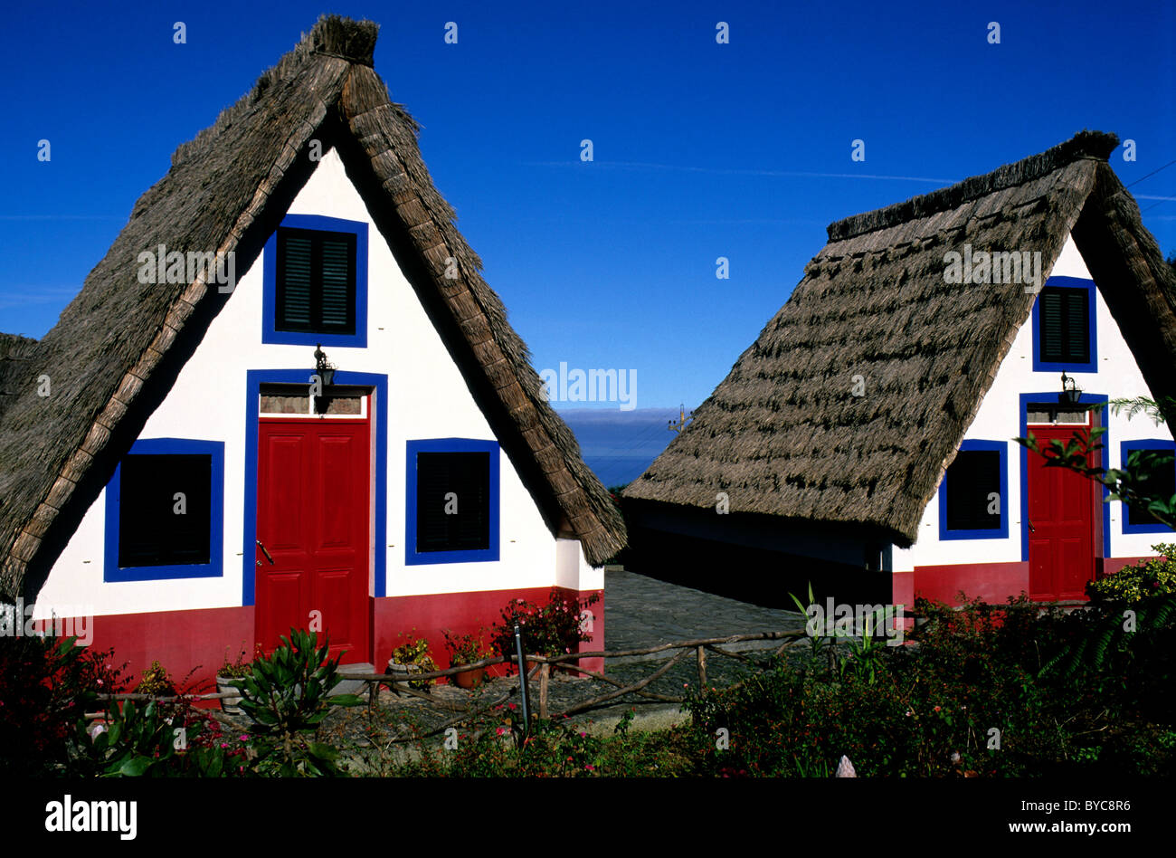 Two examples of the A-frame triangular houses unique to Madeira Stock Photo