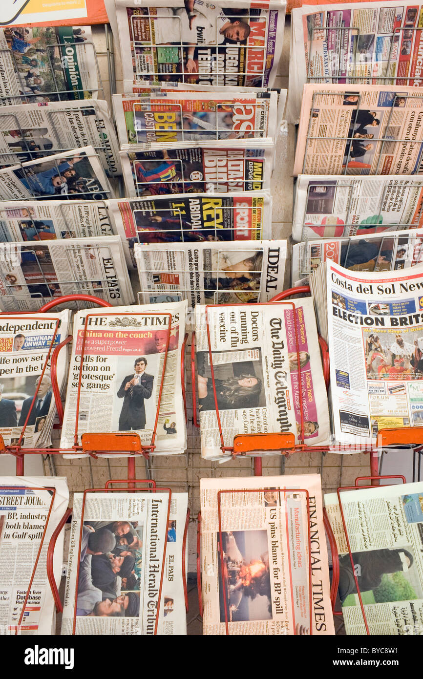 English and Spanish newspapers on sale outside shop in Fuengirola, Spain. Stock Photo