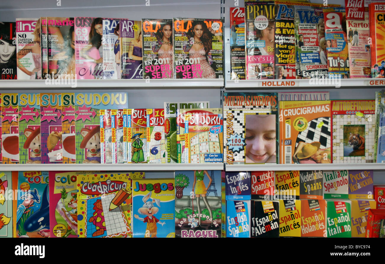 Spanish magazines, puzzle books and phrase books on sale. Stock Photo