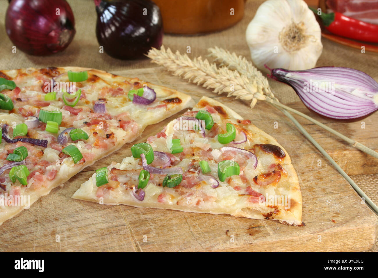 tarte flambee with bacon, red onion and leek Stock Photo Alamy