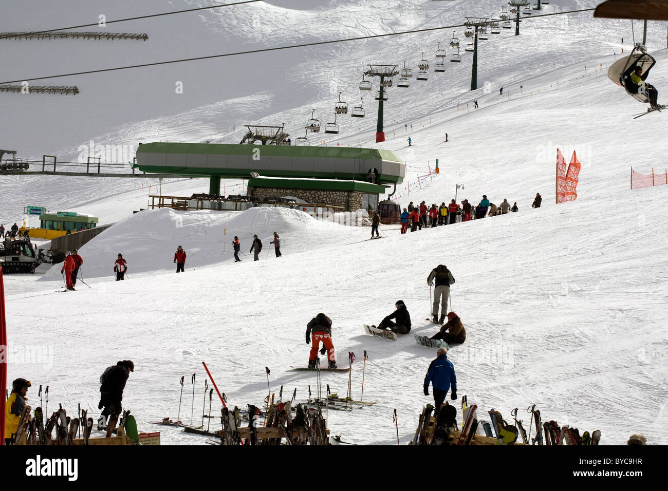 Skiers skiing on the pistes at The Passo Sella Sellajoch Selva Val gardena Dolomites Italy Stock Photo