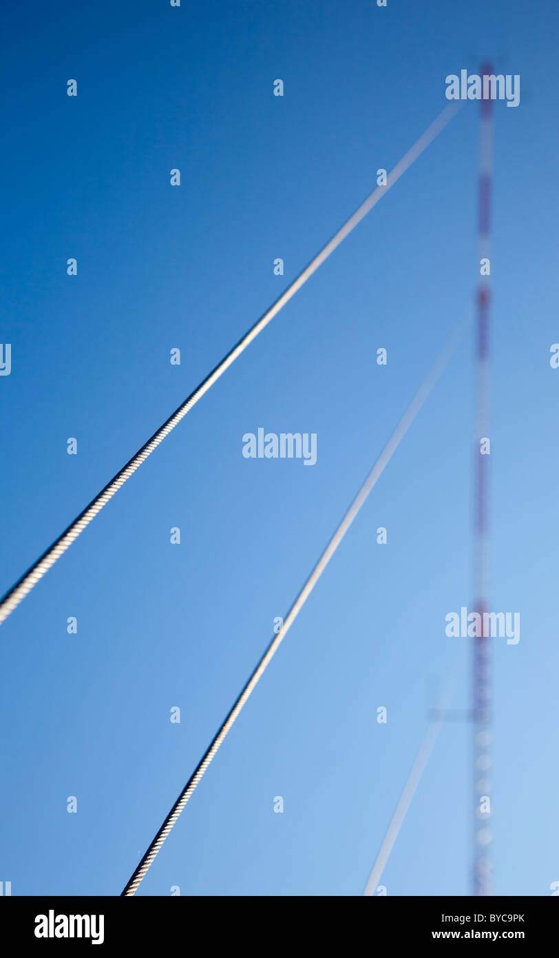 Cellular network guyed antenna tower guy wires , Finland Stock Photo