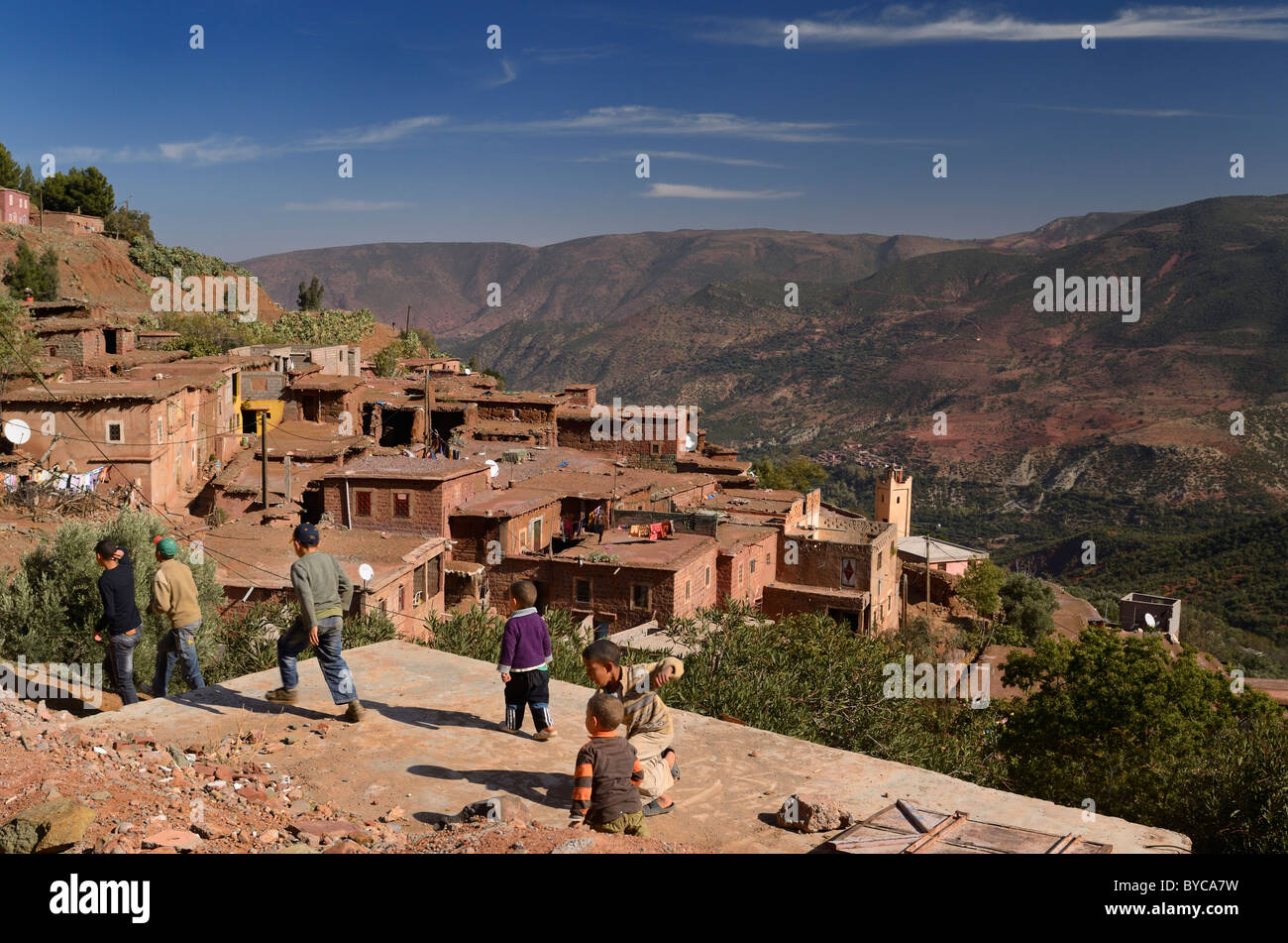 Children playing in a remote mountainside village near Ait Mannsour in the High Atlas mountains of Morocco Stock Photo