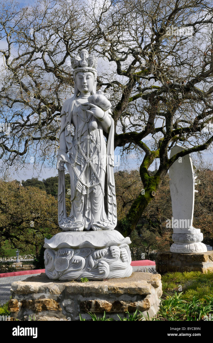 Two big statues in the Buddha Eden Garden or Garden of Peace, a