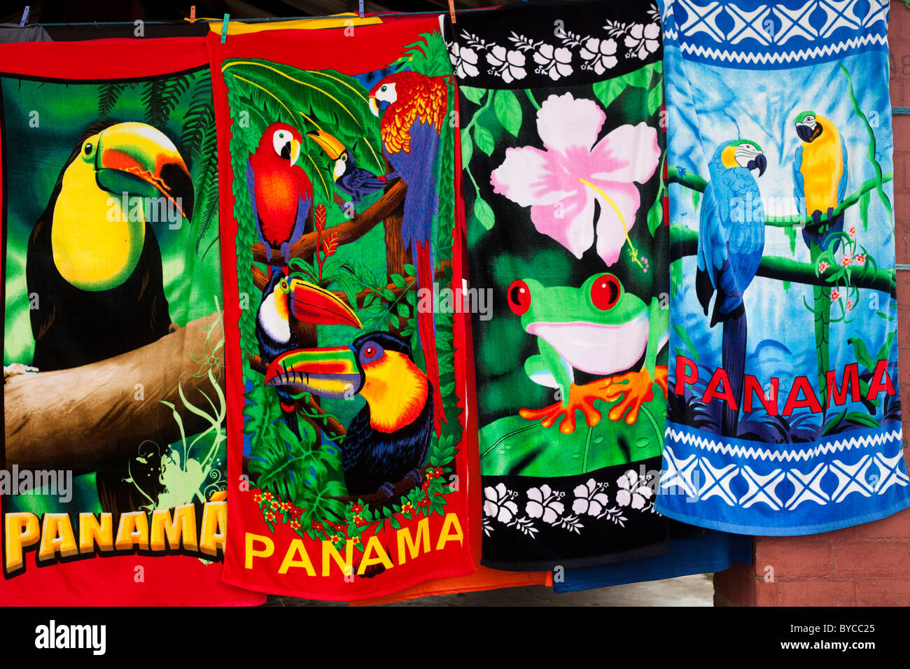 Colorful souvenirs towels from Panama with heart, dancer, toucans, parrots, nature Stock Photo