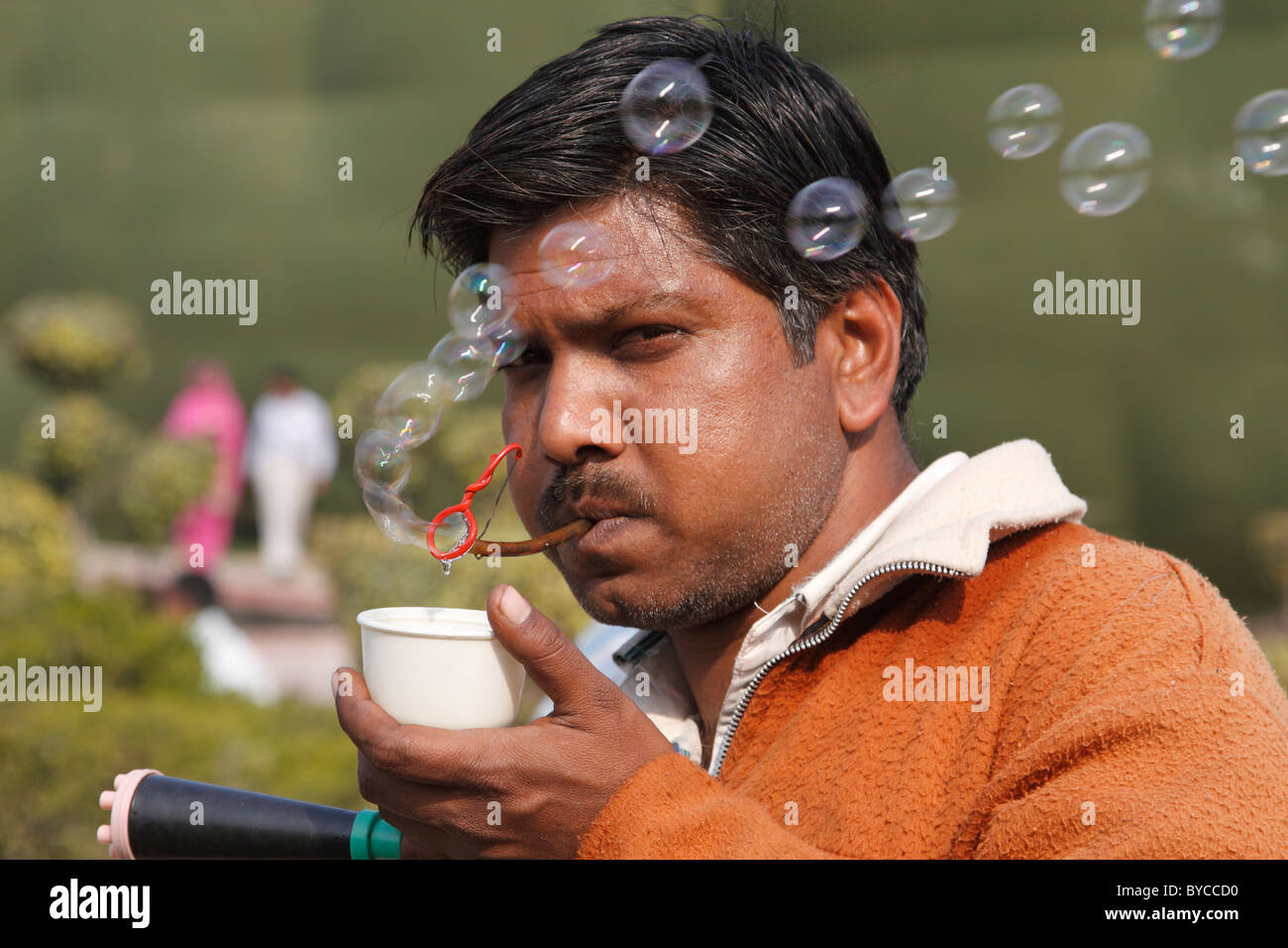 Man selling bubblemaker bubbles vendor "making bubbles" Delhi India