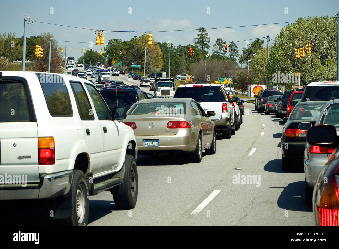 Idling traffic along Harbison Blvd. in Columbia / Irmo, SC during the lunch hour rush on one of the 1st warm humid days of March Stock Photo