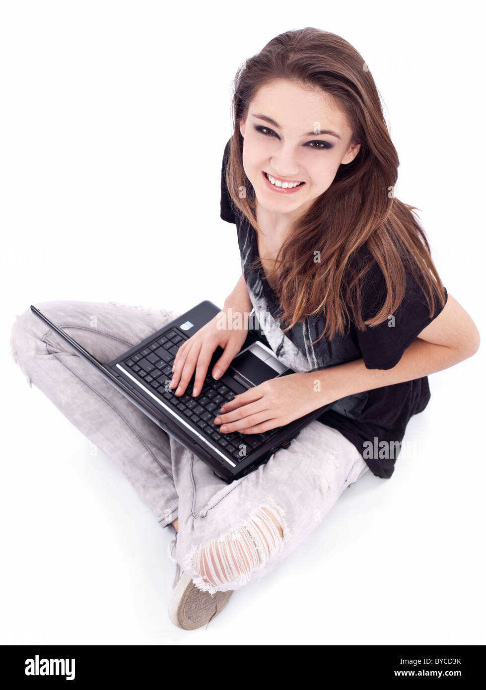 Girl working with laptop. Picture on a white background. Stock Photo