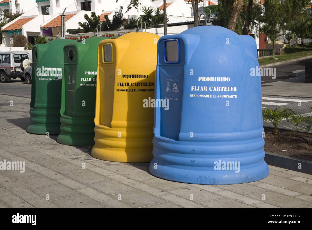 Collection of four skips/dumpsters to collect and seperate garbage, Costa Adeje, Playa de las Americas, Tenerife, Spain Stock Photo