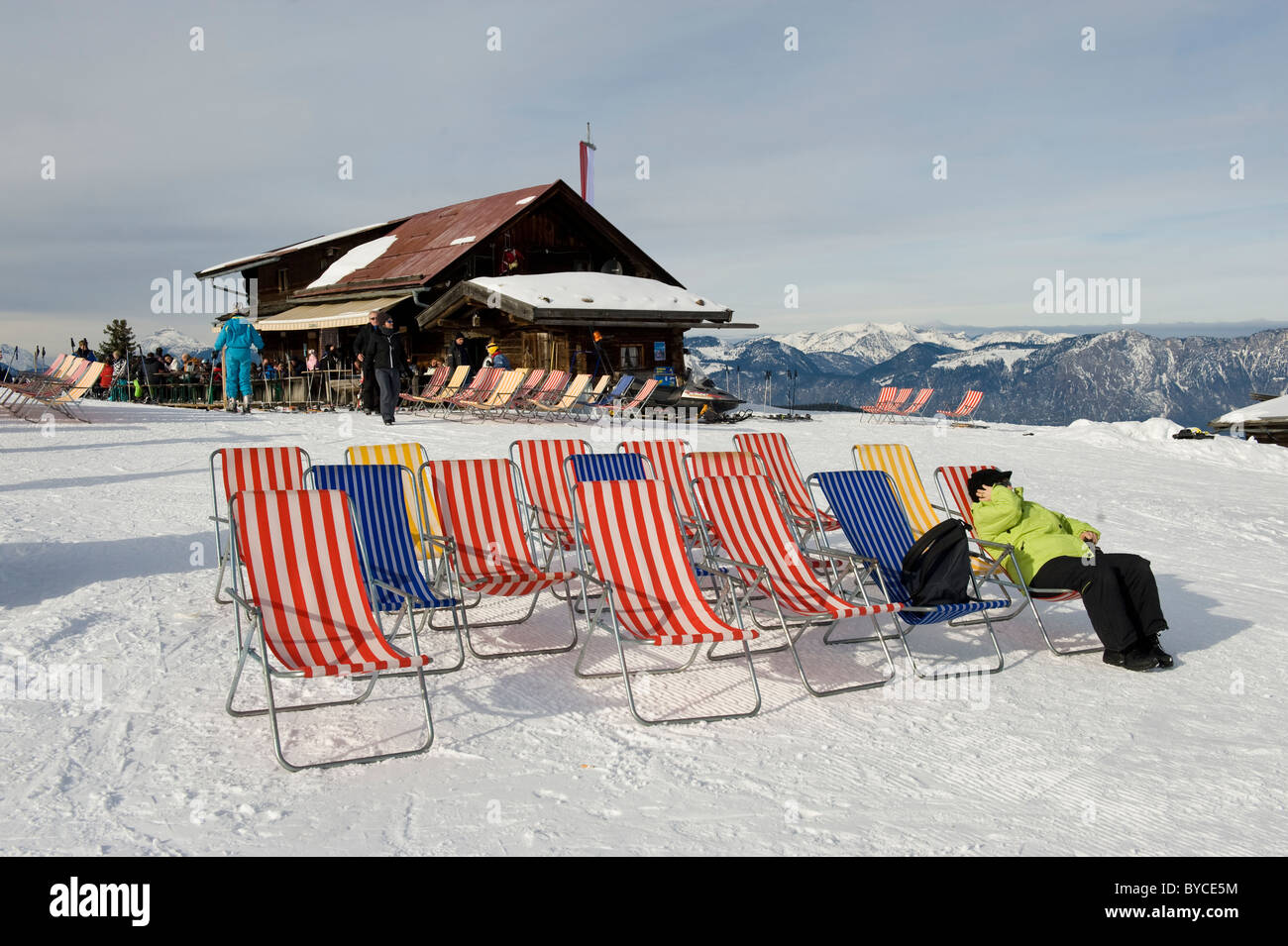 Woman relaxing making a phone call from a lounge chair on the Markbachjoch in Niederau in Austria Stock Photo