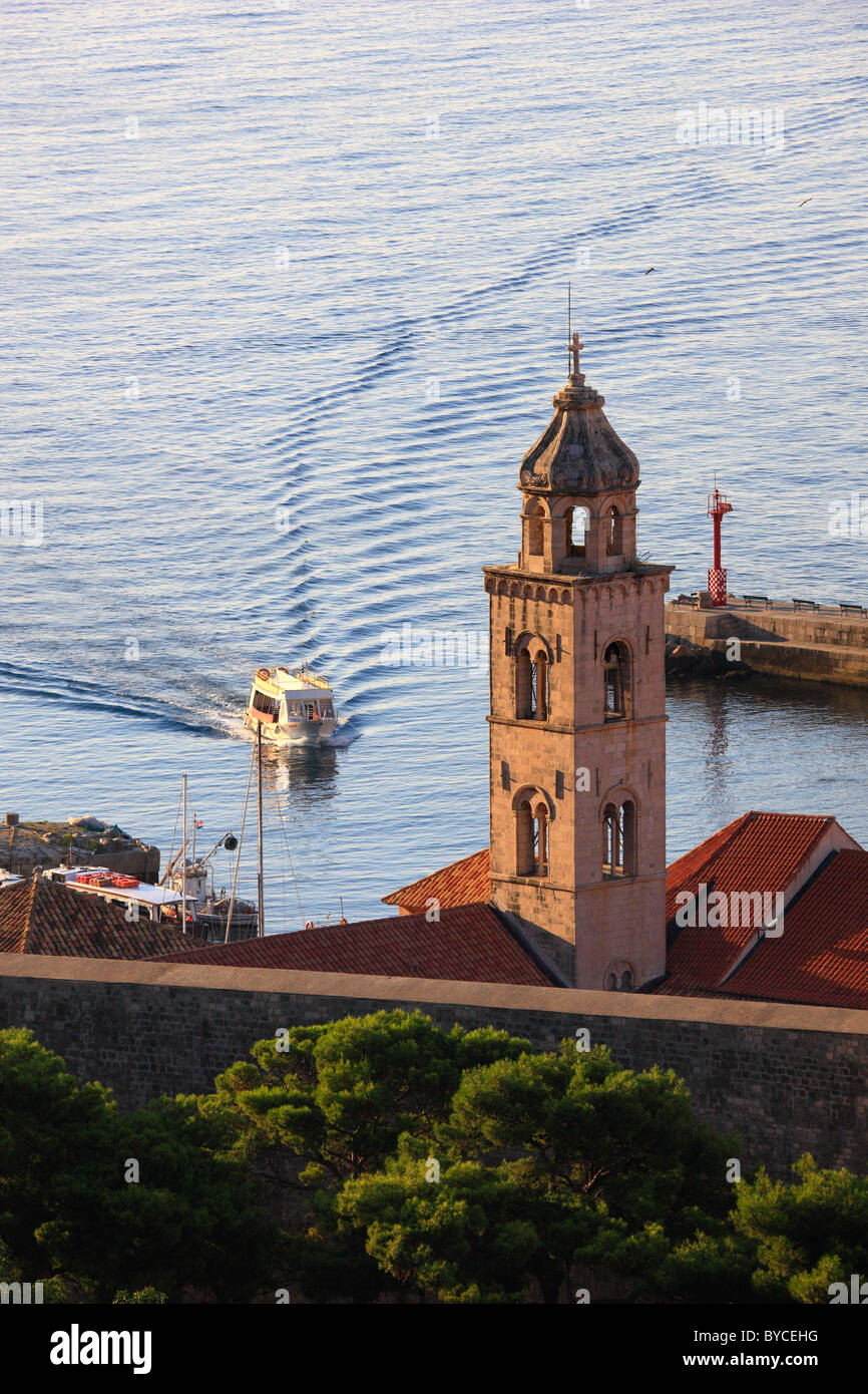 The tower of church and boat in Dubrovnik, Dalmatian coast in Croatia Stock Photo