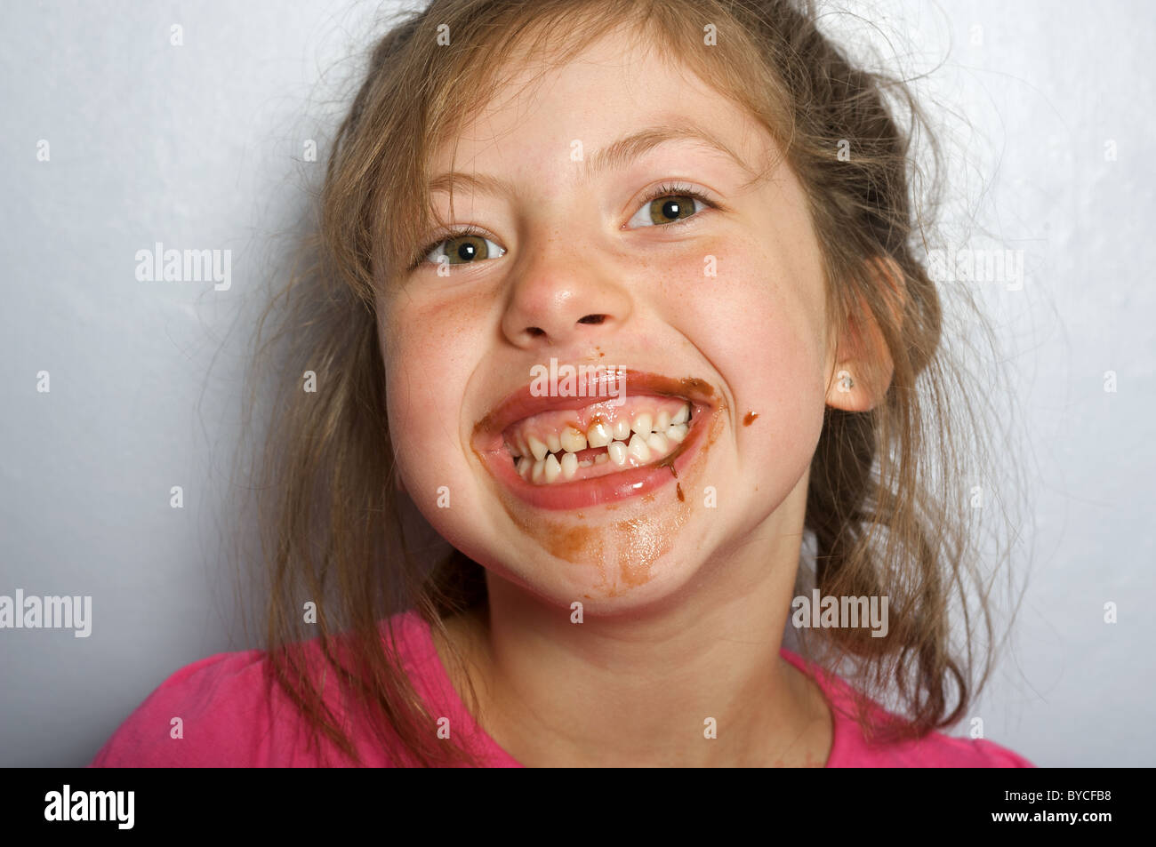 Young girl with chocolate covered face Stock Photo