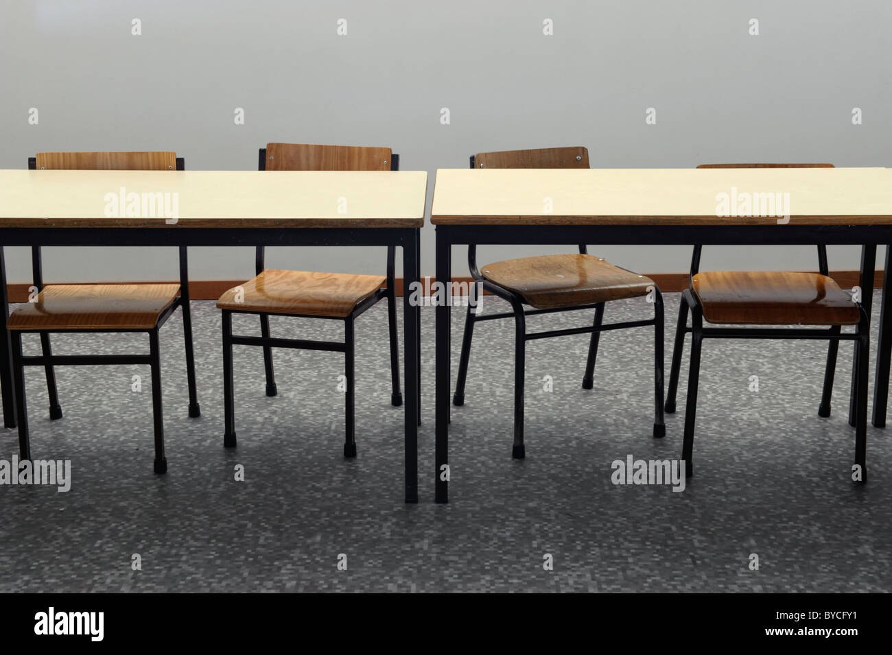 Desks and chairs at an empty classroom Stock Photo