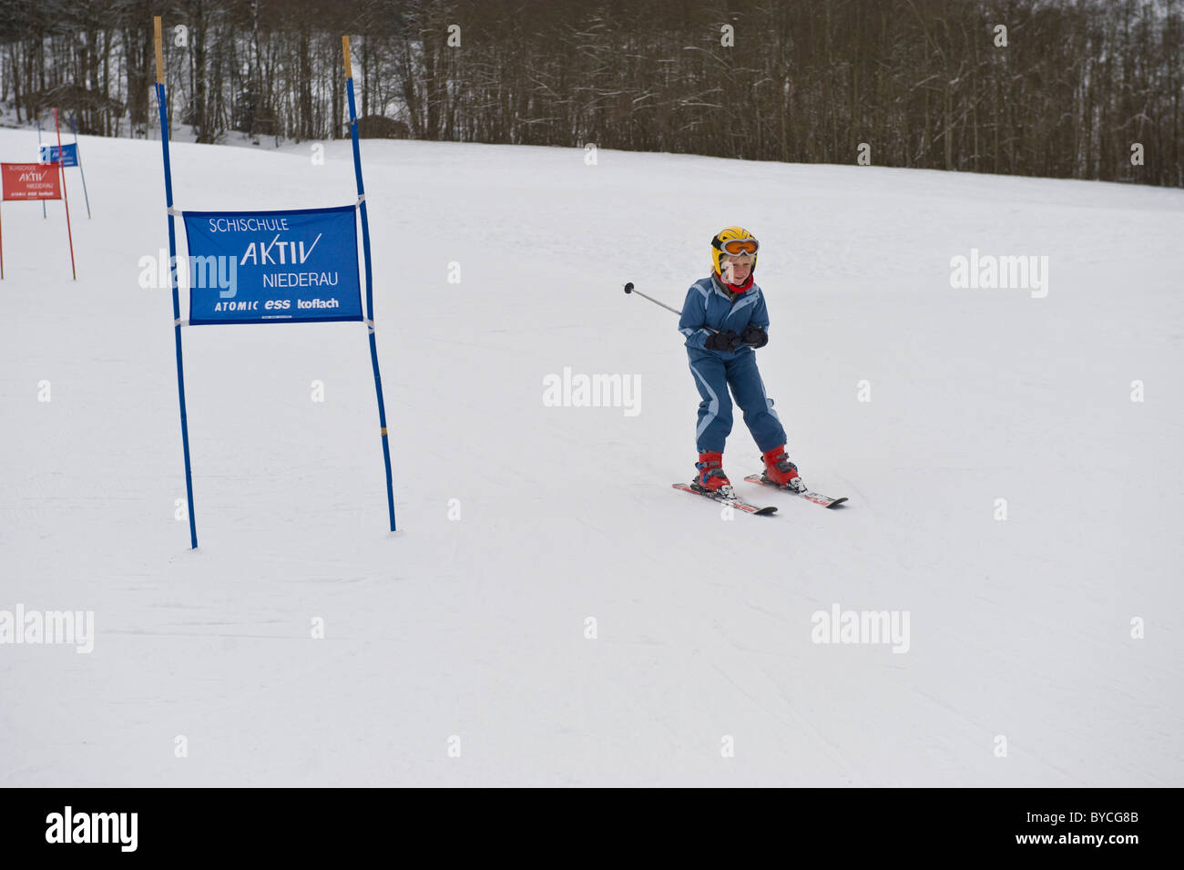 Young boy participating in a beginners slalom race in Niederau in Austria Stock Photo