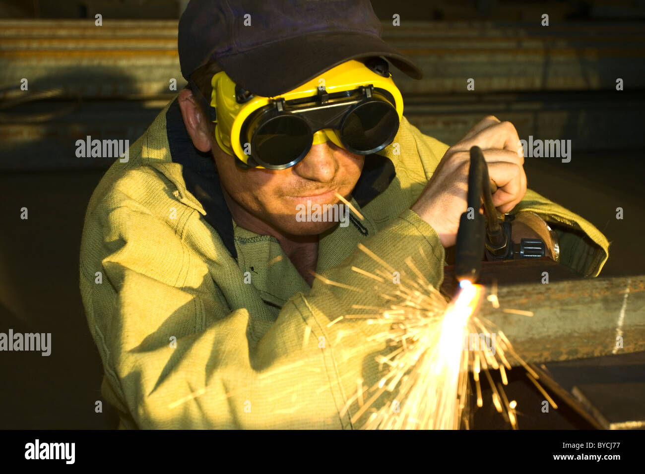 carver is ready to cut you piece of the metal Stock Photo