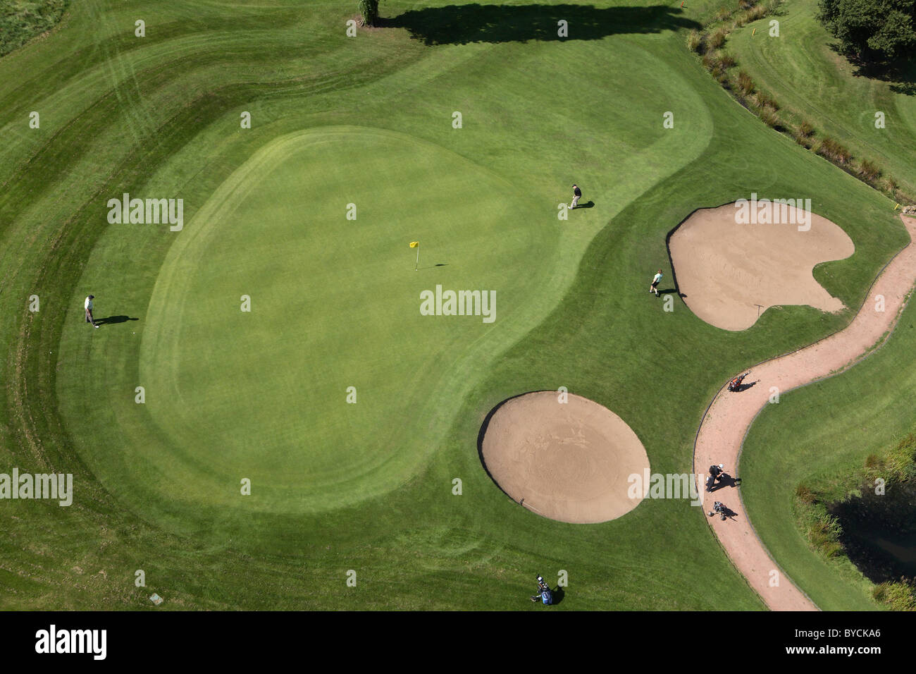 Aerial view of Golf green with bunkers and players at Branston Golf and Country club in Staffordshire UK Stock Photo