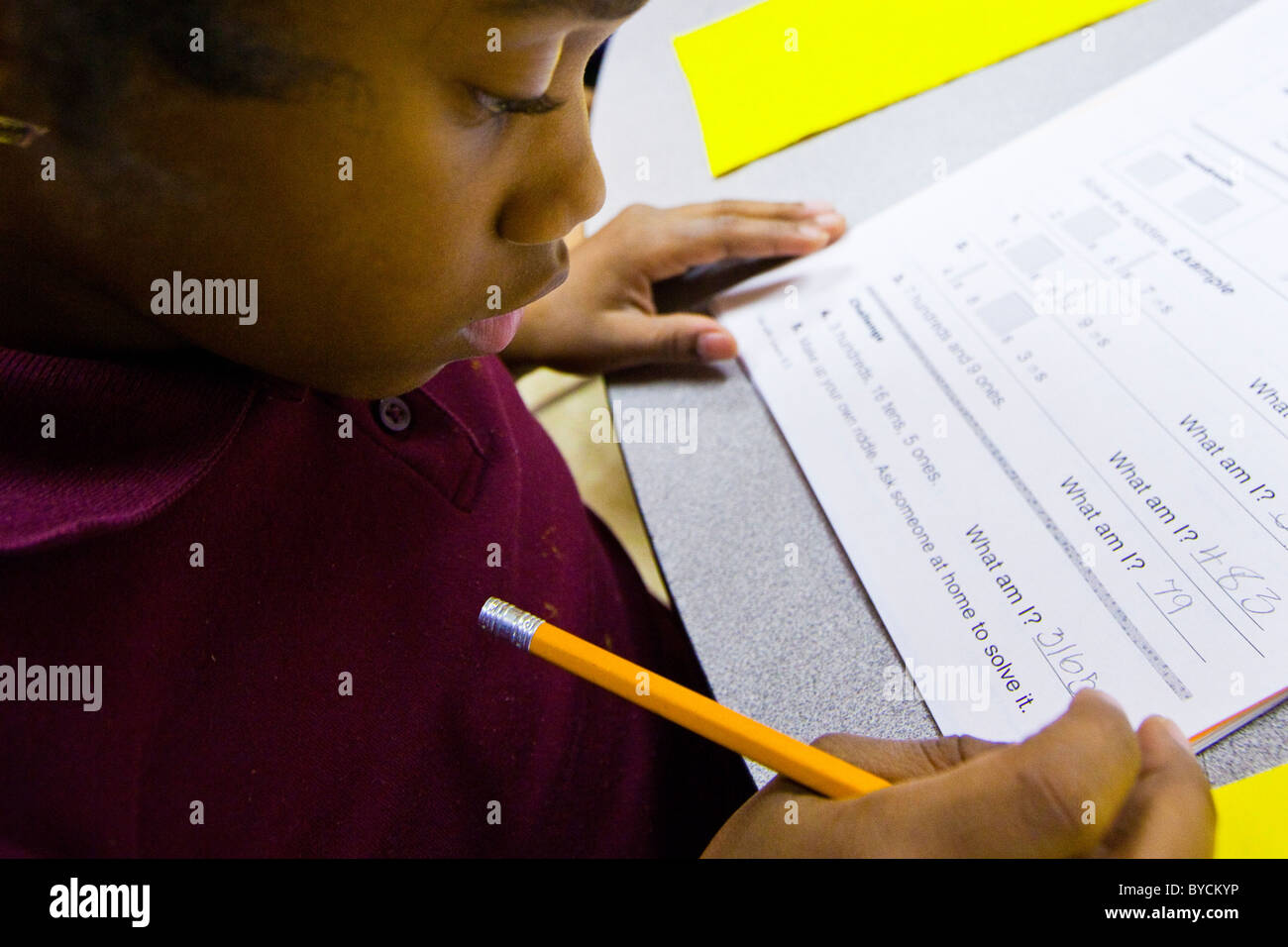 African American boy writing in a classroom in Washington DC Stock ...